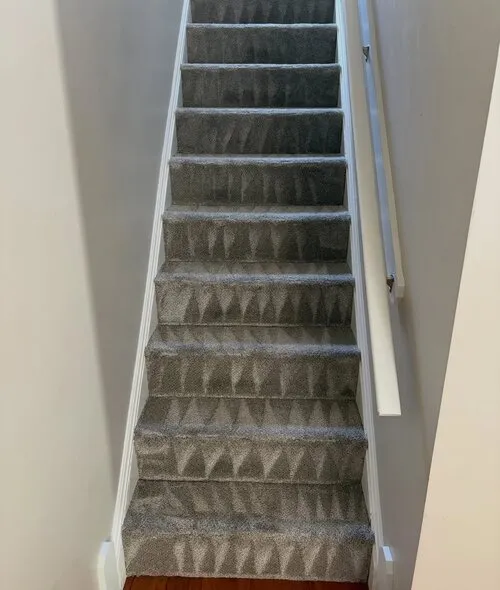 Stair carpet cleaned by hand, tread by tread